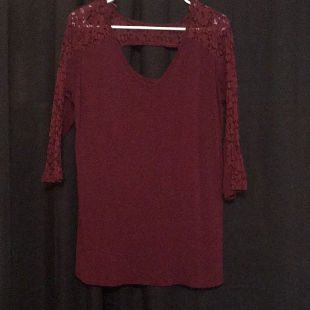 3/4 Women’s blouse. Sleeves are partly laced.